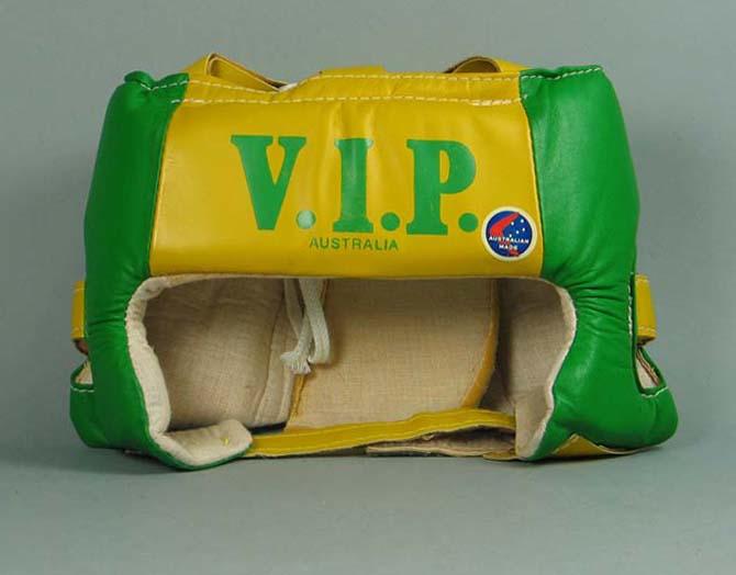 Green and gold padded boxing head guard, V.I.P. Sports brand