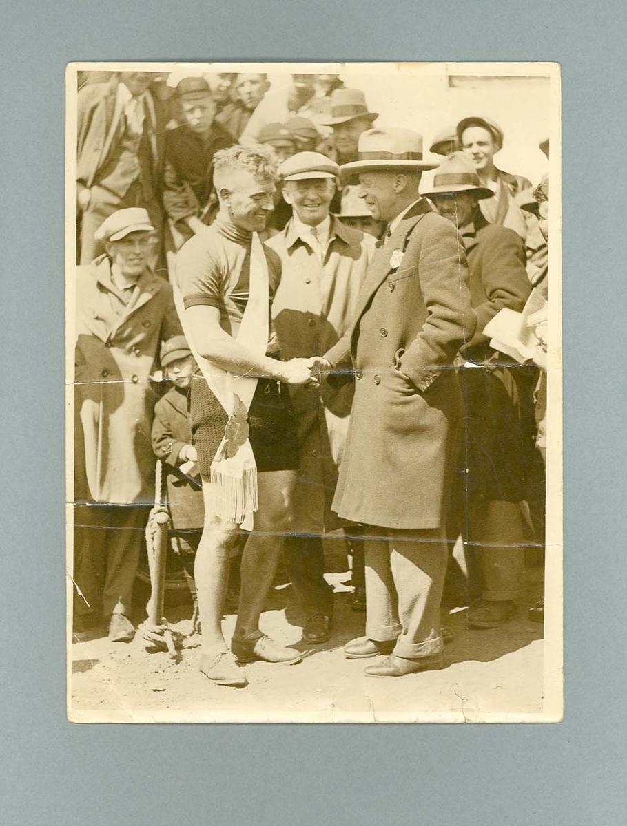 Black and white photograph of Ernie Milliken presented with Blue Riband ...